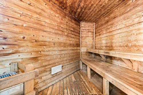 a wooden sauna with wooden walls and wooden benches at Breathtaking Lake Views 1BR King Suite, Kitchen & Heated Pools in Two Harbors