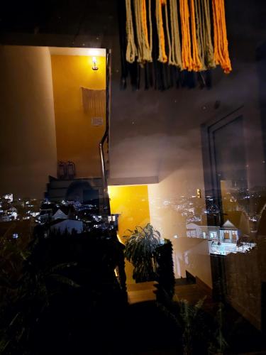 a room with a view of a city at night at Century House in Da Lat