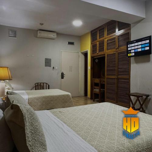 Postel nebo postele na pokoji v ubytování Hotel Dinastía