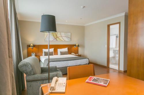 Postel nebo postele na pokoji v ubytování Plaza Rio Residences - Barra First