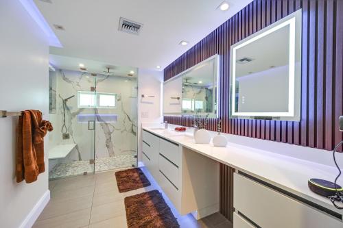 a bathroom with two sinks and a shower at Outdoor Oasis Marco Island Home Near Beaches in Marco Island