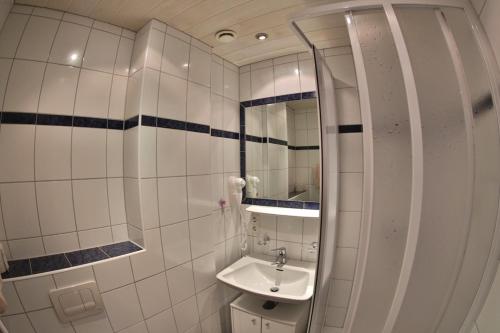 Ett badrum på Hotel Stecher