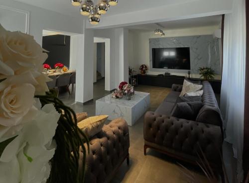 a living room with a couch and a tv at Family friendly house with a swimming pool Imotski, Zagora - 24581 in Imotski