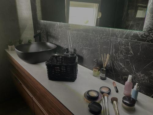 a bathroom counter with a sink and a bowl at Family friendly house with a swimming pool Imotski, Zagora - 24581 in Imotski