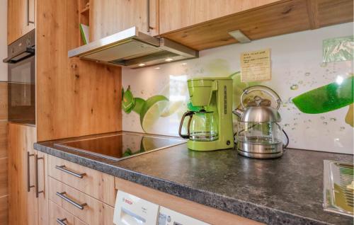 a kitchen with a counter top with a coffee maker at Two-Bedroom Holiday Home With Mountain View In St Märgen in Sankt Peter