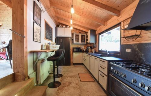 a kitchen with a stove and a sink at Villa Al Tramonto in Lisciano Niccone