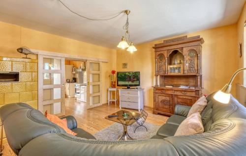 a living room with a couch and a table at Ferienwohnung Jabel in Jabel
