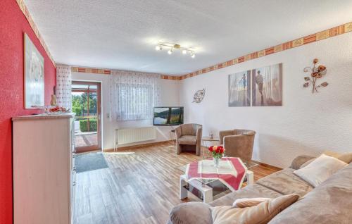 a living room with a couch and a table at Ferienwohnung Mirow in Mirow