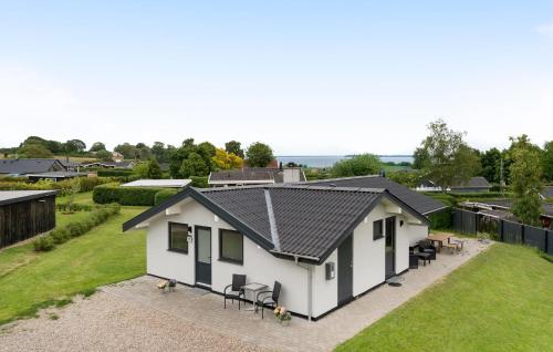 an overhead view of a white house with a black roof at 3 Bedroom Stunning Home In Hejls in Hejls