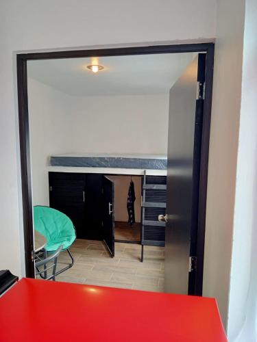 a room with a door open to a room with a cat at Depa centrico de 2 Hab Incluye WIFI y limpieza in Teziutlán