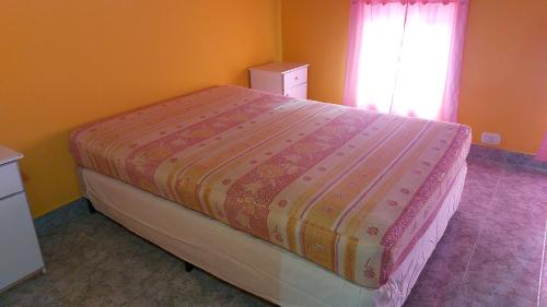 En eller flere senge i et værelse på Casa Painanbi