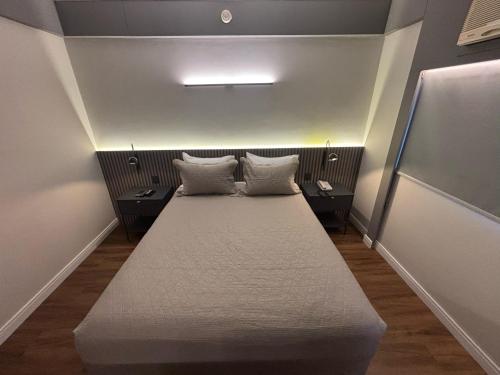 Кровать или кровати в номере Hotel Vila Mariana Ibirapuera Com Garagem 409