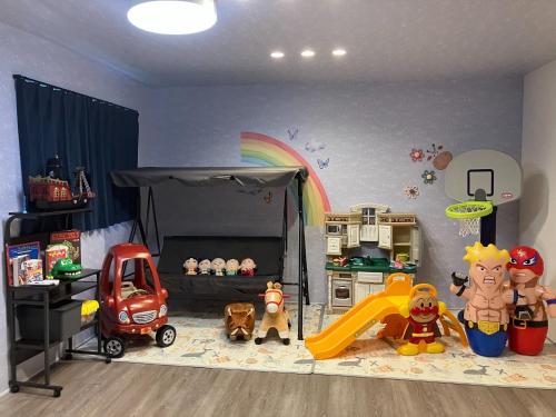 a childs room with a playroom with toys and a rainbow at VILLA PRECI - Vacation STAY 85974v in Teruma