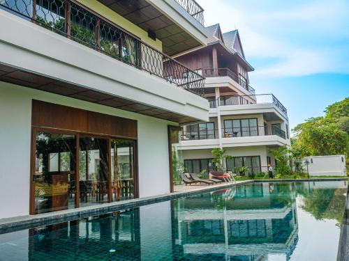 an external view of a house with a swimming pool at S48 River Ping in Chiang Mai