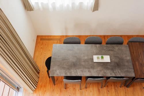 a conference room with a table and chairs at Nicostay Katsuura Beach in Fukuoka