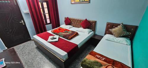 a bedroom with a bed with a tray of food on it at Vasudev Retreat in Chamoli