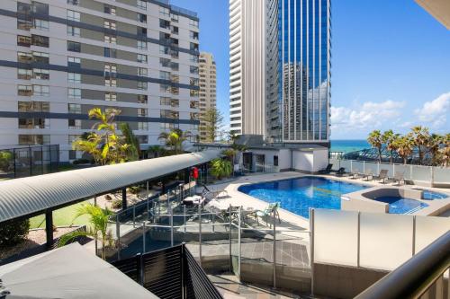a view of a building with a swimming pool at Unbeatable Location - Spacious 3 bedroom townhouse in Gold Coast