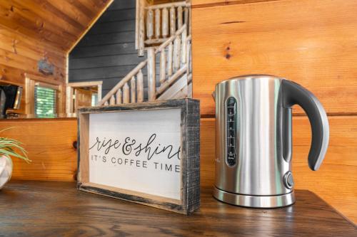 a coffee pot sitting on a table in a cabin at Serenity Escape in Sevierville