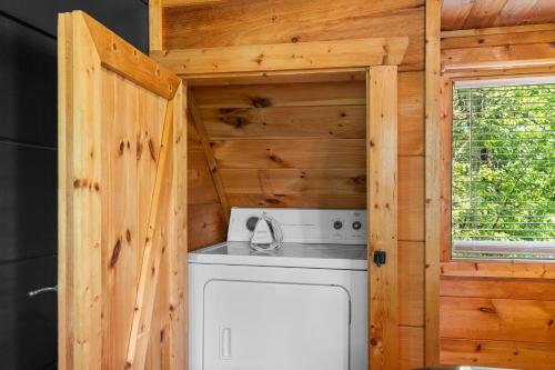 a kitchen with a stove and a refrigerator at Serenity Escape in Sevierville