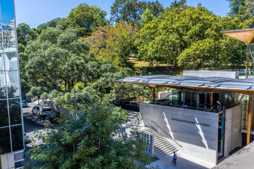 an overhead view of a building with trees in the background at Central Apt with Art Gallery Views and FREE Parking in Auckland