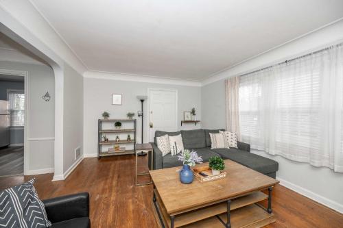 a living room with a couch and a table at Kenwood Keys 1 - Cozy Stay for 6 in Cincinnati