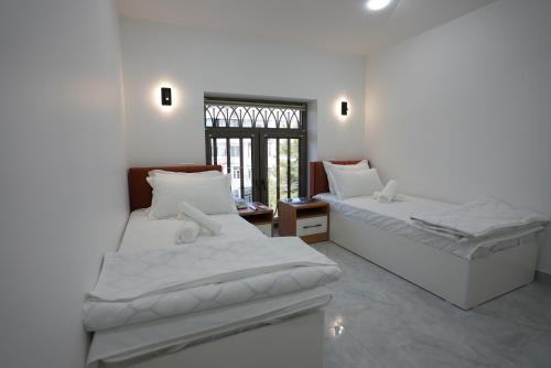 Кровать или кровати в номере Kamilovs' Hotel