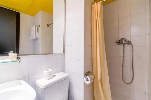a bathroom with a shower and a toilet and a sink at Colors in Barcelona