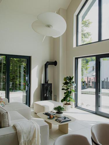 a living room with a couch and a fireplace at Babiogórska Stodoła in Zawoja