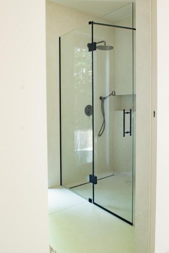 a glass shower in a bathroom with a glass door at Babiogórska Stodoła in Zawoja