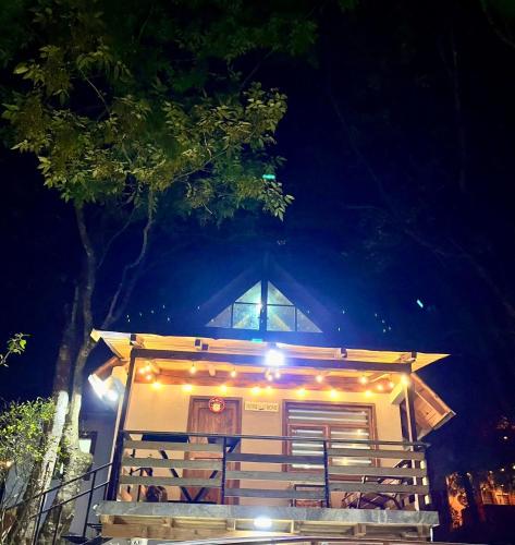 a small house with lights on it at night at Cabaña en Mazamitla - Onix in Mazamitla