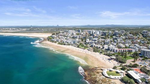 an aerial view of a beach and a city at Tides and Tranquility at Kings Beach in Caloundra