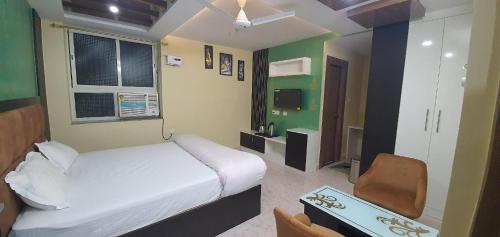 Hotel Prem Residencyにあるベッド