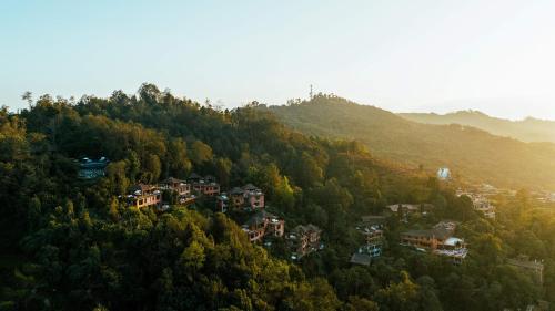 a village on top of a hill with trees at Dwarika's Sanctuary in Dhulikhel