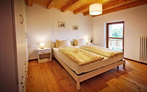 Albergo Diffuso Tolmezzoにあるベッド