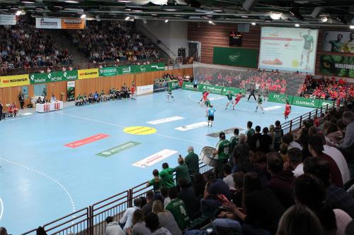 a crowd of people watching a game of volleyball at Best Western Hotel Würzburg-Süd in Würzburg