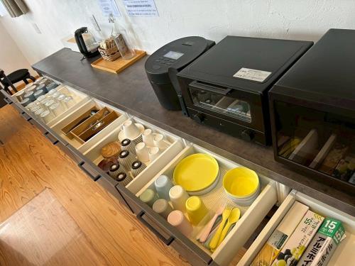 a toaster oven sitting on top of a counter at Nicostay Katsuura Beach in Fukuoka