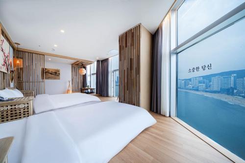 Postel nebo postele na pokoji v ubytování Hotel Badada