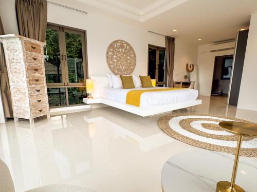 a bedroom with a bed and a large window at Magnifique Vue Mer - Villa Hidden Paradise Samui in Bophut 