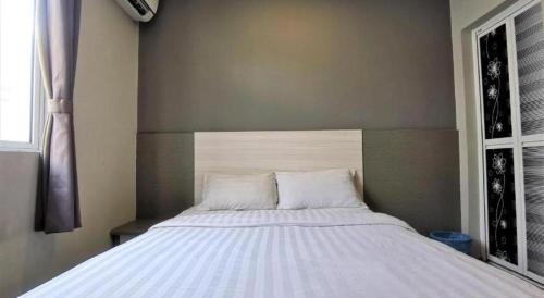Cama o camas de una habitación en Pearl Hotel