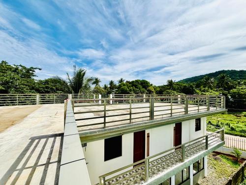 a roof of a building with a fence at BossBabe Nacpan Beach House in El Nido