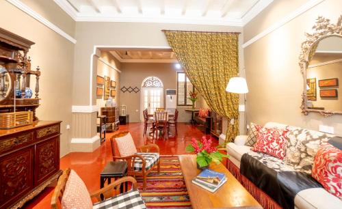 a living room with a couch and a table at Argus Residences in George Town