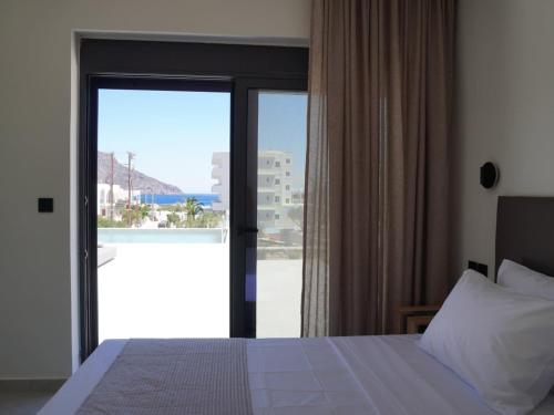 Letto o letti in una camera di Avli Luxury Villas
