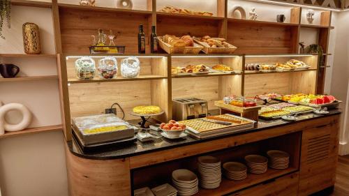 a buffet with many different types of food on display at Petit Palace Chueca in Madrid
