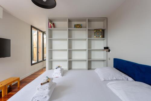 a bedroom with a bed with towels on it at Private Studio rooftop & Tour Eiffel View in Boulogne-Billancourt
