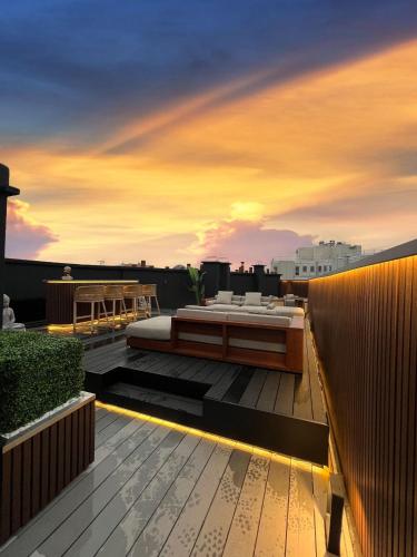 a bed on the roof of a building at Private Studio rooftop & Tour Eiffel View in Boulogne-Billancourt