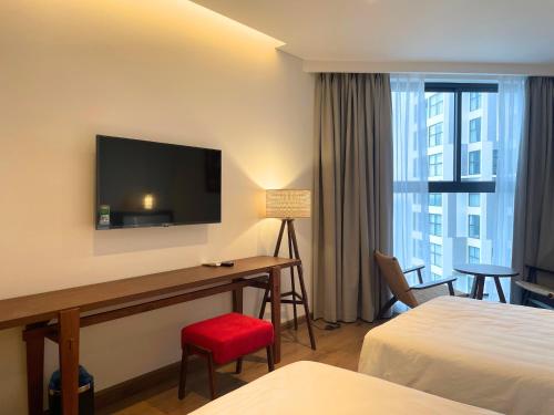 Postel nebo postele na pokoji v ubytování Cactos Inn Apartment APEC Mandala Cham Bay Mui Ne