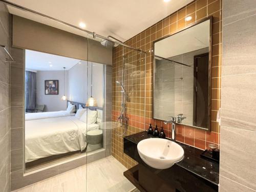 Koupelna v ubytování Cactos Inn Apartment APEC Mandala Cham Bay Mui Ne