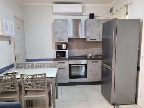 Kuchyň nebo kuchyňský kout v ubytování Central Suites