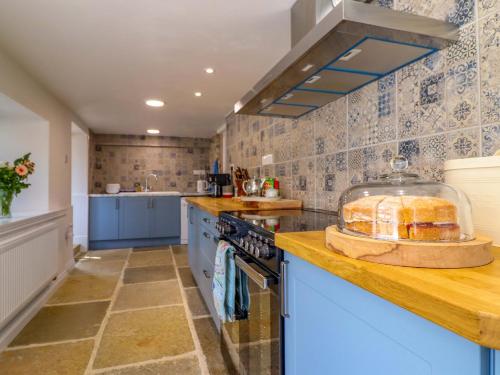 a kitchen with a counter with a loaf of bread on it at Upper Dolarddyn in Welshpool