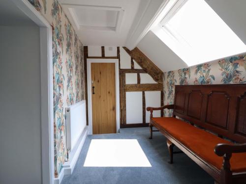 a room with a bed and a skylight at Upper Dolarddyn in Welshpool